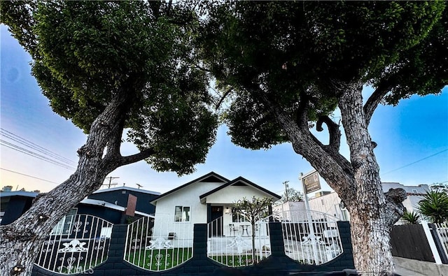 4021 York Blvd, Glassell Park, CA 90065 - bungalow with a fenced front yard, stucco siding, and a gate