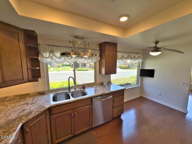 37134 Village 37, Camarillo, CA 93012 - kitchen featuring stainless steel dishwasher, a raised ceiling, dark wood-type flooring, a ceiling fan, and brown cabinetry