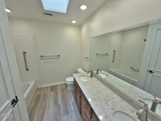 37134 Village 37, Camarillo, CA 93012 - bathroom with a skylight, double vanity, shower / tub combination, and wood finished floors