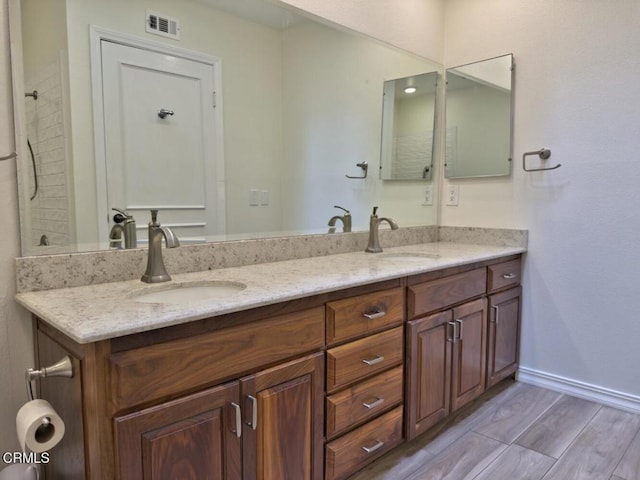 37134 Village 37, Camarillo, CA 93012 - bathroom with double vanity and wood finished floors