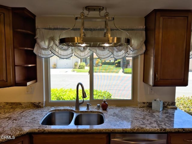 37134 Village 37, Camarillo, CA 93012 - kitchen featuring light stone counters, open shelves, and stainless steel dishwasher