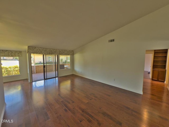 37134 Village 37, Camarillo, CA 93012 - unfurnished room with plenty of natural light, dark wood-style floors, and lofted ceiling