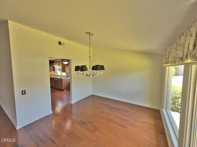 37134 Village 37, Camarillo, CA 93012 - unfurnished dining area featuring a chandelier, wood finished floors, and vaulted ceiling