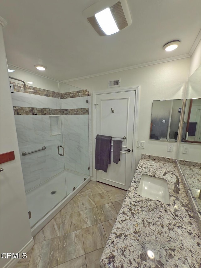 37134 Village 37, Camarillo, CA 93012 - full bathroom with ornamental molding, double vanity, a shower stall, and marble finish floors