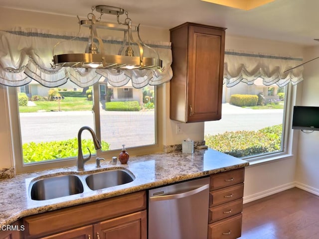 37134 Village 37, Camarillo, CA 93012 - kitchen featuring dishwasher, light stone countertops, brown cabinetry, and dark wood-style flooring