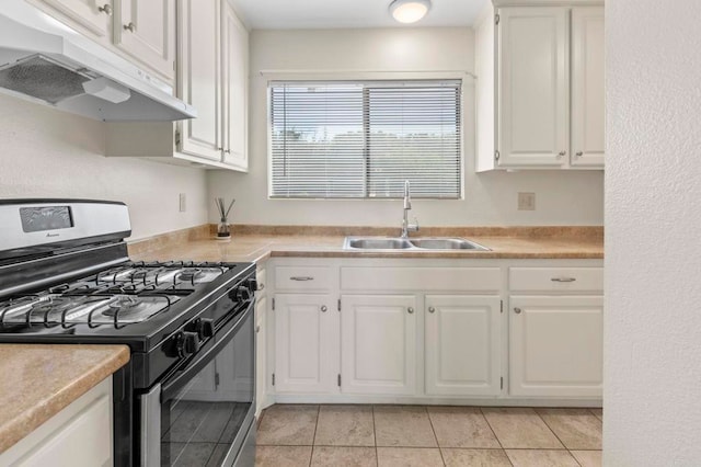 1523 Temple Heights Dr, Oceanside, CA 92056 - kitchen with range with gas stovetop, under cabinet range hood, white cabinetry, and light countertops