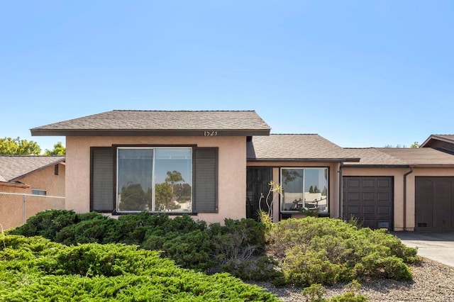 1523 Temple Heights Dr, Oceanside, CA 92056 - view of front of home with an attached garage, stucco siding, driveway, and a shingled roof