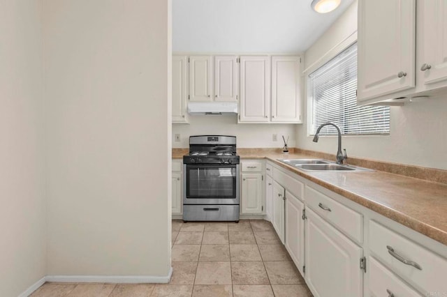 1523 Temple Heights Dr, Oceanside, CA 92056 - kitchen featuring gas range, under cabinet range hood, white cabinets, and light countertops