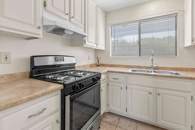 1523 Temple Heights Dr, Oceanside, CA 92056 - kitchen featuring stainless steel range with gas cooktop, under cabinet range hood, white cabinets, and light countertops
