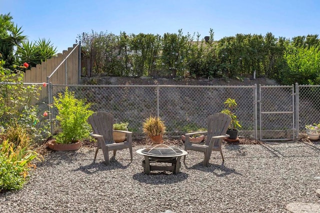 1523 Temple Heights Dr, Oceanside, CA 92056 - view of patio featuring a fire pit and a gate