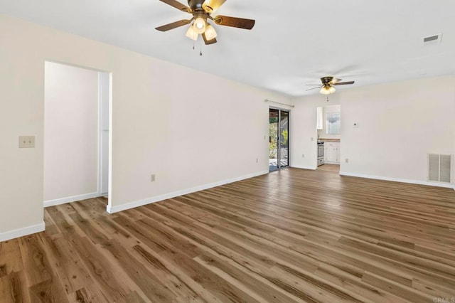 1523 Temple Heights Dr, Oceanside, CA 92056 - unfurnished living room featuring ceiling fan and wood finished floors