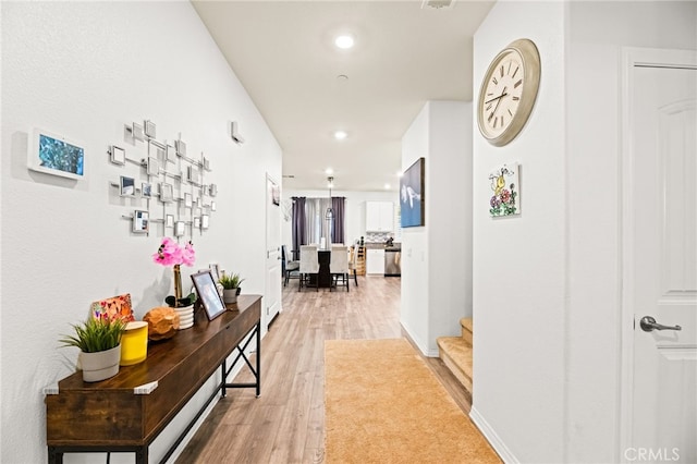 27555 Mountainside St, Menifee, CA 92584 - hallway featuring light wood-type flooring, recessed lighting, and stairs