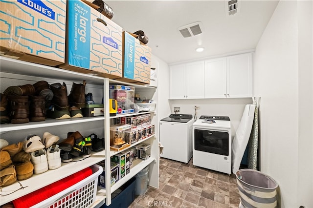 27555 Mountainside St, Menifee, CA 92584 - washroom with washing machine and dryer, cabinet space, stone finish floors, and recessed lighting