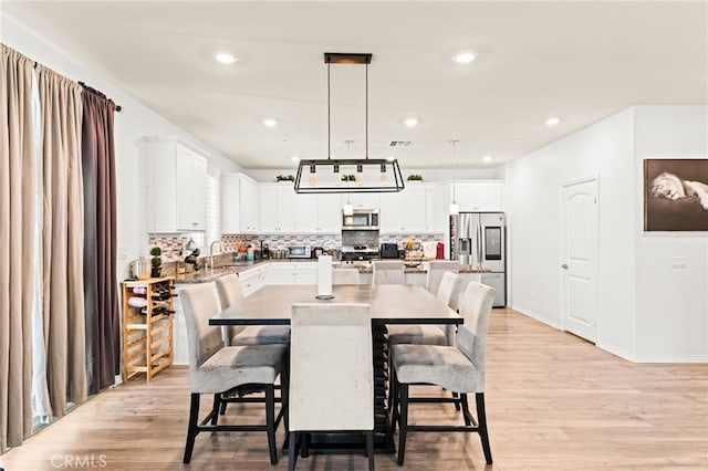 27555 Mountainside St, Menifee, CA 92584 - dining space featuring light wood-type flooring and recessed lighting