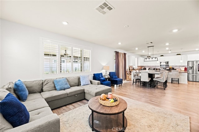 27555 Mountainside St, Menifee, CA 92584 - living area with recessed lighting and light wood-type flooring