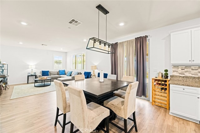 27555 Mountainside St, Menifee, CA 92584 - dining space with light wood finished floors and recessed lighting