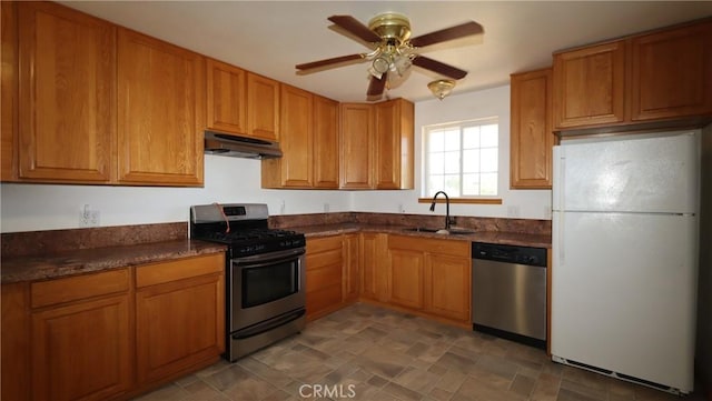 16141 Jessie St, Lower Lake, CA 95457 - kitchen with appliances with stainless steel finishes, under cabinet range hood, brown cabinets, and ceiling fan