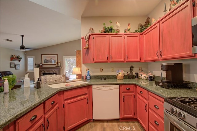 1320 Fairway Dr, Atwater, CA 95301 - kitchen with white dishwasher, open floor plan, ceiling fan, stone counters, and light wood finished floors