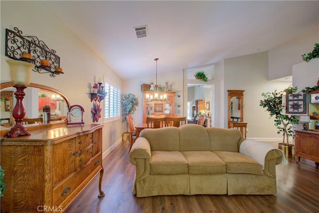 1320 Fairway Dr, Atwater, CA 95301 - living room with vaulted ceiling, a chandelier, and wood finished floors