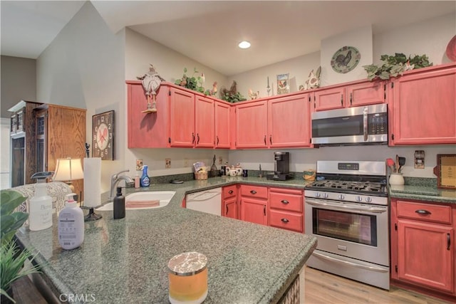 1320 Fairway Dr, Atwater, CA 95301 - kitchen featuring appliances with stainless steel finishes, a peninsula, light wood-style floors, recessed lighting, and dark brown cabinets
