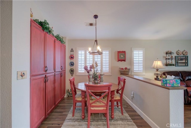 1320 Fairway Dr, Atwater, CA 95301 - dining room with dark wood-style floors and a chandelier