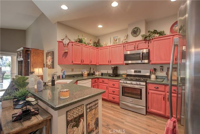 1320 Fairway Dr, Atwater, CA 95301 - kitchen with appliances with stainless steel finishes, a peninsula, light wood-style floors, and recessed lighting