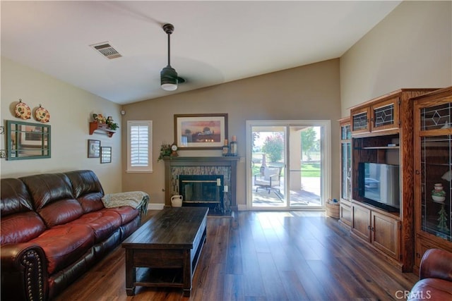 1320 Fairway Dr, Atwater, CA 95301 - living room featuring lofted ceiling, dark wood-type flooring, and a glass covered fireplace