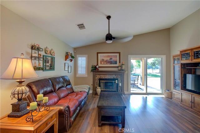 1320 Fairway Dr, Atwater, CA 95301 - living room featuring lofted ceiling, wood finished floors, a fireplace, ceiling fan, and plenty of natural light