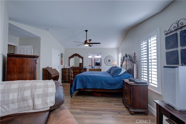 1320 Fairway Dr, Atwater, CA 95301 - bedroom featuring lofted ceiling, wood finished floors, and a ceiling fan