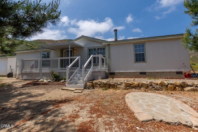 3629 Center St, Piru, CA 93040 - view of front of property with crawl space and a wooden deck