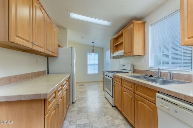 3629 Center St, Piru, CA 93040 - kitchen featuring white appliances, light countertops, stone finish floors, under cabinet range hood, and decorative light fixtures