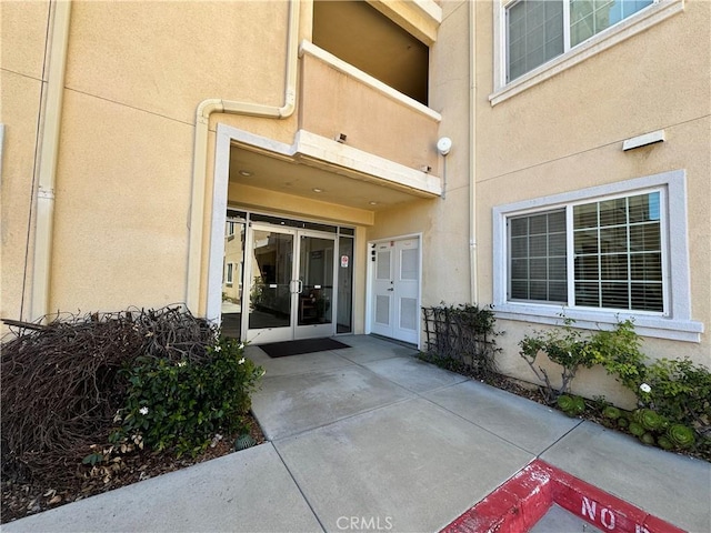3120 Sepulveda Blvd Unit 409, Torrance, CA 90505 - view of exterior entry with french doors and stucco siding
