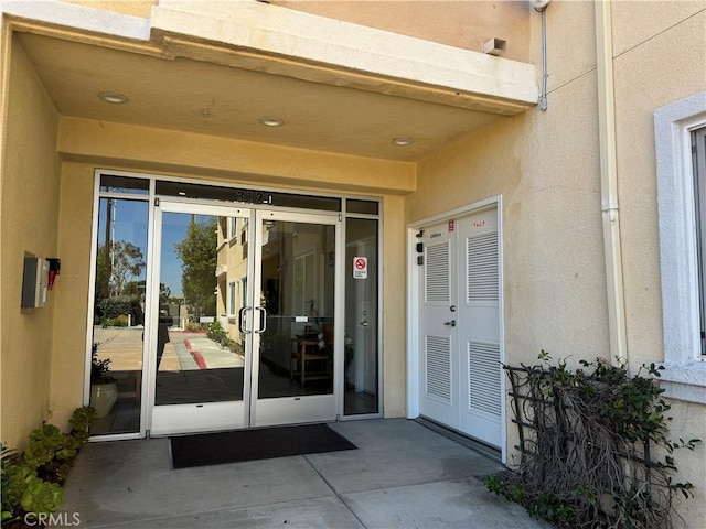 3120 Sepulveda Blvd Unit 409, Torrance, CA 90505 - doorway to property with stucco siding and french doors