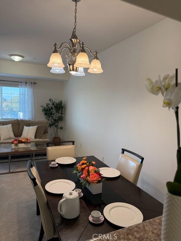 3120 Sepulveda Blvd Unit 409, Torrance, CA 90505 - dining space with a chandelier