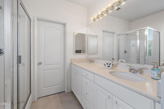 104 W Santa Clara St, Ventura, CA 93001 - bathroom featuring a shower stall, double vanity, and tile patterned floors