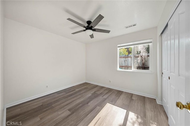 4742 Pauline Pl, Kelseyville, CA 95451 - unfurnished bedroom with wood finished floors, a closet, and ceiling fan