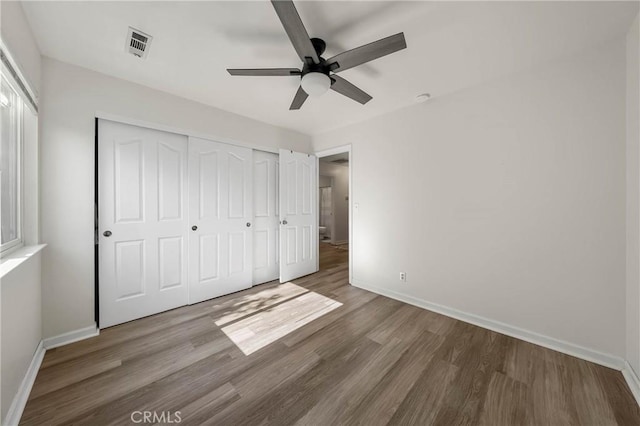 4742 Pauline Pl, Kelseyville, CA 95451 - unfurnished bedroom featuring wood finished floors, a closet, and a ceiling fan