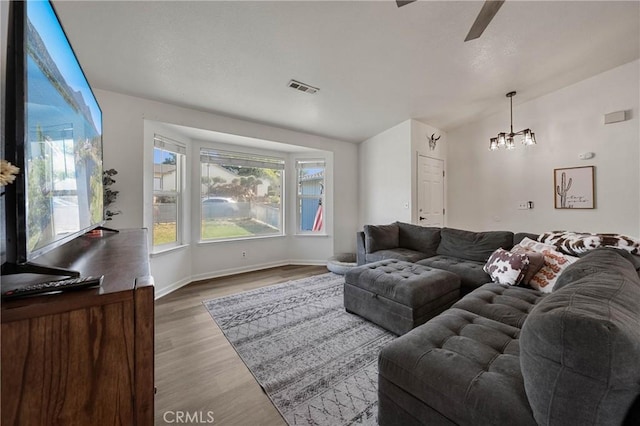 4742 Pauline Pl, Kelseyville, CA 95451 - living area with ceiling fan, wood finished floors, and a chandelier