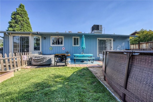 4742 Pauline Pl, Kelseyville, CA 95451 - rear view of house with a patio, a chimney, and board and batten siding