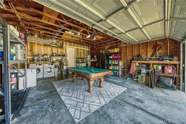 4742 Pauline Pl, Kelseyville, CA 95451 - garage featuring washing machine and clothes dryer, black fridge, and a garage door opener