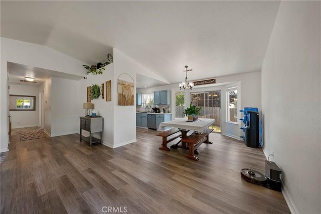4742 Pauline Pl, Kelseyville, CA 95451 - living area featuring lofted ceiling, a chandelier, dark wood-style floors, and plenty of natural light