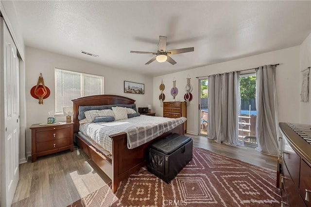 4742 Pauline Pl, Kelseyville, CA 95451 - bedroom featuring access to outside, wood finished floors, ceiling fan, and a closet