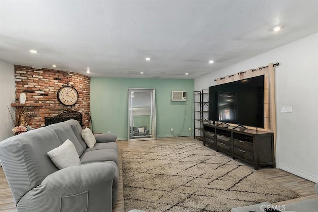5228 N G St, San Bernardino, CA 92407 - living room featuring light wood finished floors, a wall mounted AC, recessed lighting, and a fireplace