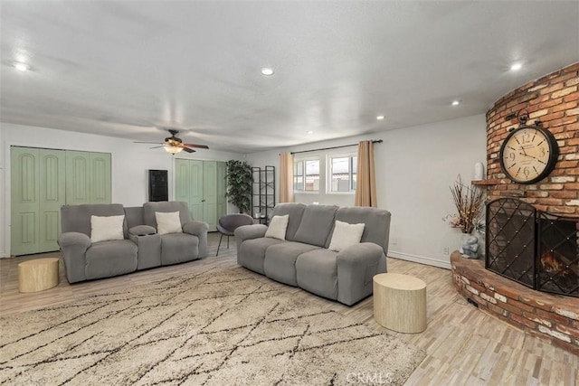 5228 N G St, San Bernardino, CA 92407 - living area with wood finished floors, a fireplace, ceiling fan, and recessed lighting