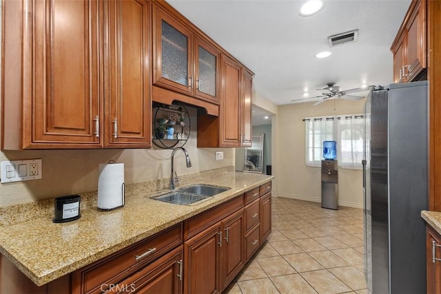 5228 N G St, San Bernardino, CA 92407 - kitchen with freestanding refrigerator, a ceiling fan, light tile patterned flooring, recessed lighting, and light stone countertops