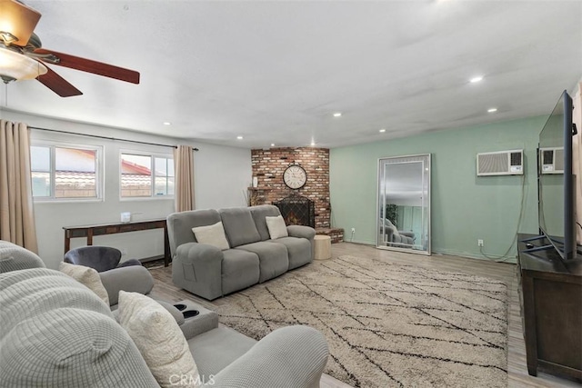 5228 N G St, San Bernardino, CA 92407 - living room with ceiling fan, recessed lighting, a wall mounted AC, wood finished floors, and a fireplace