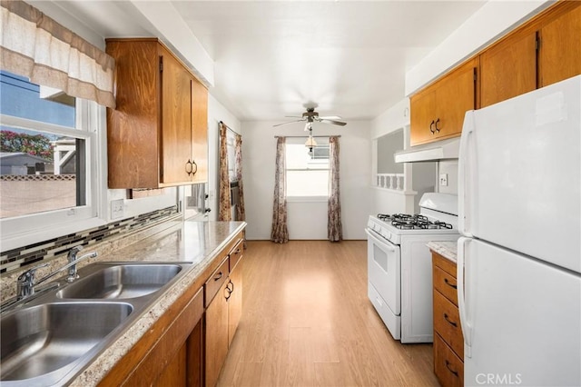 473 W Roberta Ave, Fullerton, CA 92832 - kitchen featuring white appliances, under cabinet range hood, ceiling fan, light wood finished floors, and brown cabinetry