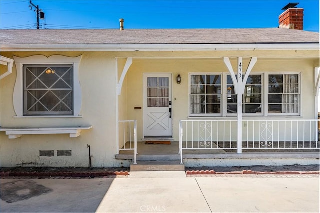 473 W Roberta Ave, Fullerton, CA 92832 - doorway to property with roof with shingles, a chimney, and stucco siding