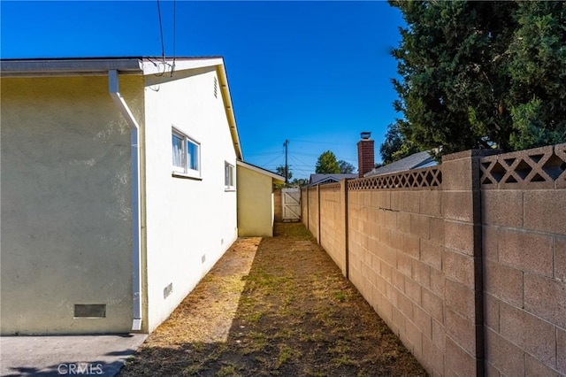473 W Roberta Ave, Fullerton, CA 92832 - view of side of property featuring crawl space and stucco siding