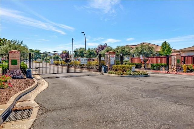 2757 Traditions, Paso Robles, CA 93446 - view of asphalt street featuring a gate, a gated entry, and curbs